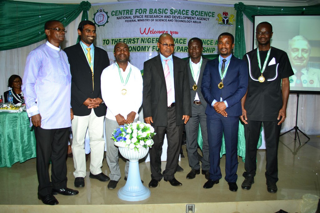 from  left: Bonaventure Okere (Regional Coordinator for the West African Regional Office of Astronomy for Development, Nigeria), Kevin Govender (Director of the IAU Office of Astronomy for Development, South Africa), Zaka K. Zacharie (Country Coordinator for Ivory Coast), Fidelix Opara (Director of the Centre for Basic Space Science in Nigeria), Kam Sie Zacharie (Country Coordinator for Burkina Faso), Eric Aggrey (Country Coordinator for Ghana), Patrice Okouma (Country Coordinator for Gabon) and Piero Benvenuti joining by video in the background (IAU General Secretary). credits: IAU/ Dele from the Centre for Basic Space Science, Nigeria